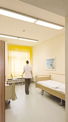Patient room at the psychiatric clinic lit by Philips
