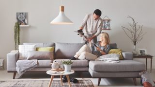 Two people sitting on the couch at home enjoying high quality LED light